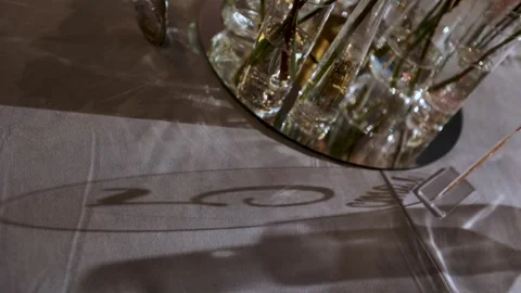 The shadow of the number 5 on the table Stock Footage 308447586