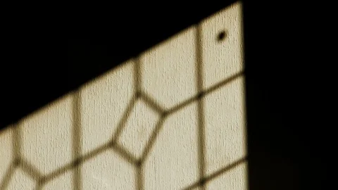 Shadow o a window moving along a wall. Time lapse Stock Footage 112754374