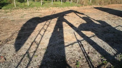 Shadow on Oil Beam Pump (Sucker Rod or Pumpjack) in the Country Side. Stock-Footage 40133542