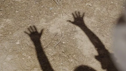 Shadow or hands and arms up in the air in empowerment and spirituality 動画素材 339074796