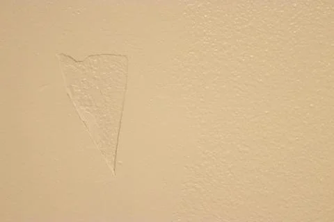 Shadow outline of a patch job over a hole Stock Photos