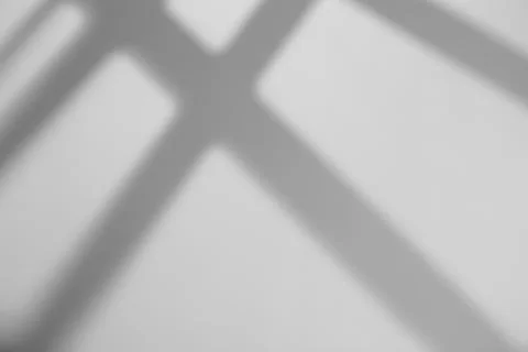 Shadow overlay effect. Shadows of window frames, bars and lines on the wall i Stock Photos