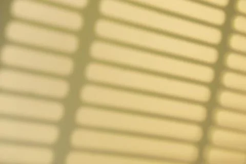 Shadow overlay effect. Shadows of window frames, bars and lines on the wall i Stock Photos