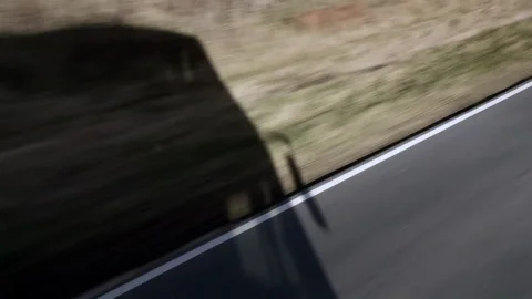 Shadow of a Passenger Bus Moving Along a Rural Road in Argentina - 4K Stock Footage 336685425
