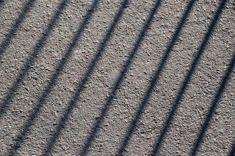 Shadow pattern on the pavement, long lines in monochrome tones Foto stock