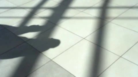 Shadow from people on the floor. Stockbeeldmateriaal 156048915