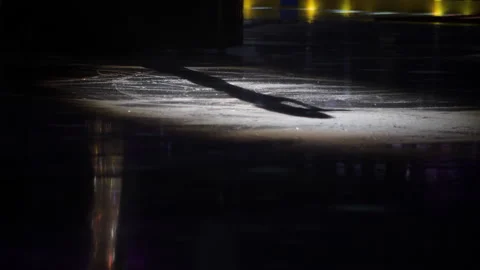 Shadow of a performer with a microphone on a circle of light on ice 스톡 동영상 171602905