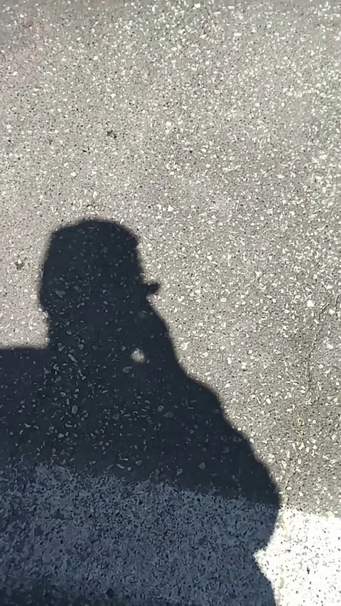 Shadow of a person under the angle of the sun Stock-Footage 306573754