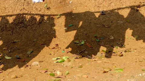 A shadow photo of a clothes drying in the sun Stock Photos