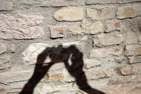 The shadow of the photographer on the wall Stock Photos