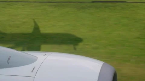 Shadow of a plane projected on seeded fields Stock Footage 146741742