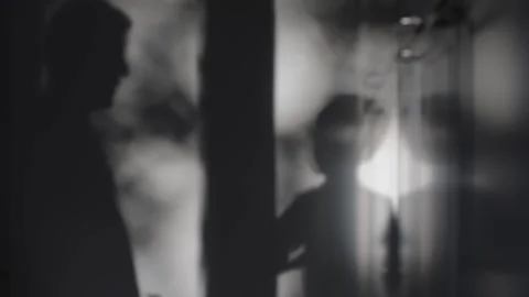 Shadow play of boy reflected on gray wall light and shadow games featuring boy Video stock 280608041