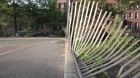 A shadow plays along the rails of a fallen fence Video stock 40361754