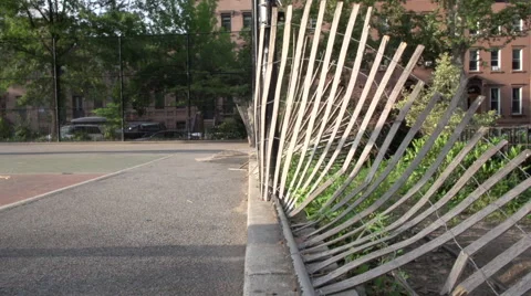 A shadow plays along the rails of a fallen fence Video stock 40361956