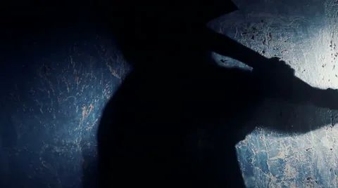 Shadow of psycho maniac chopping at victim with axe, blood-chilling thriller 動画素材 59084453