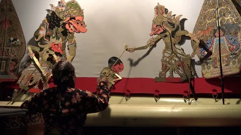 Shadow puppet master at Wayang Kulit performance in theater Indonesia Stock Footage 78468282