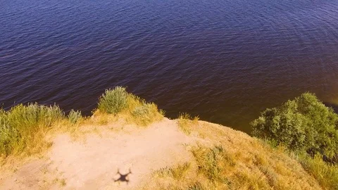 The shadow of a quadcopter on the shore Stock Footage 111196128