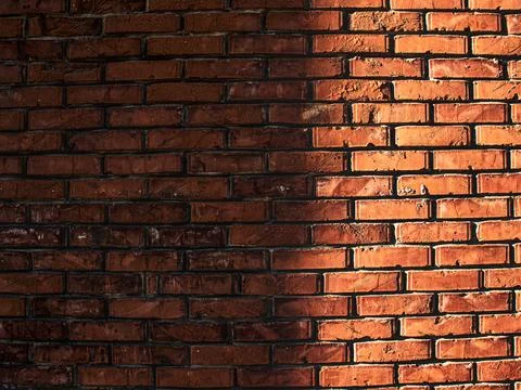 Shadow on red brick wall, brick texture Stock Photos