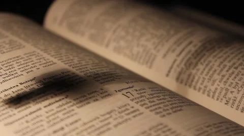 Shadow of a rosary on open Bible Stock Footage 49240517