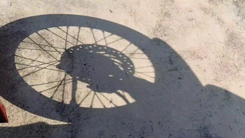 Shadow of a rotating motorcycle Stockbeeldmateriaal 292342671