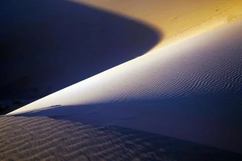 Shadow on the sand dune Stock Photos