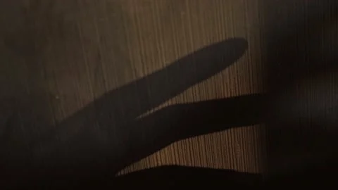 Shadow of a scary hand on the wall, close-up Stock Footage 194705141