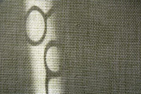 Shadow of scissors on green fabric Stock Photos