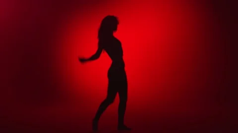 Shadow seductive feminine dancer performing strip plastic choreography. Wide Stock Footage 151286161
