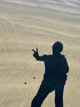Shadow of Silhouette on the Beach Stock Photos