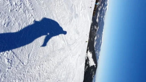 Shadow of snowboarder at ski slope Stock Footage 166964229