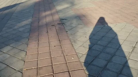Shadow of someone walking Stock Footage 213226523