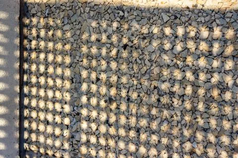 Shadow on the stone wall of the balcony. Stock Photos