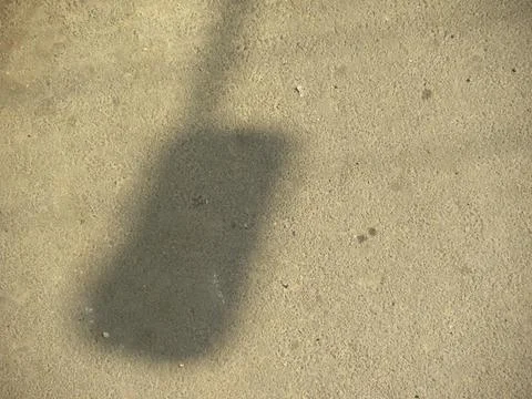Shadow of street light lamp on road Stock Photos
