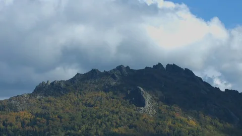 The shadow from the sun passes over the mountain Stock Footage 78589506