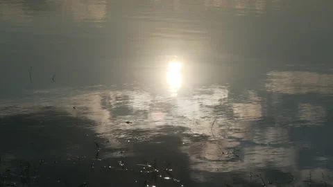 The shadow of the sunset reflected on the surface of the lake. Stock Footage 171145436