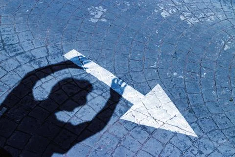 Shadow throwing arrow Stock Photos