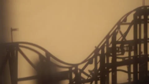 Shadow of a toy rolling roller coaster Stock Footage 130286722