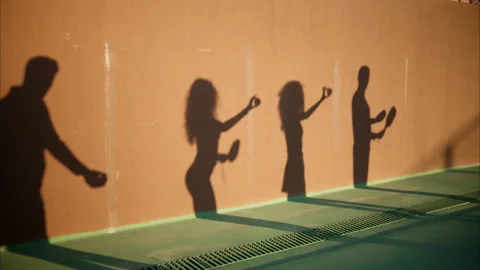 The shadow of two men and two women prac... | Stock Video | Pond5