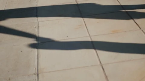 Shadow of walking child Stock Footage 86510393