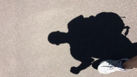 Shadow of a walking person Stock Footage 196418049
