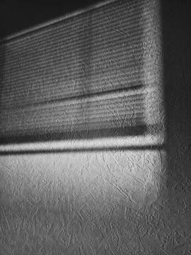 Shadow on the wall from the blinds Stock Photos
