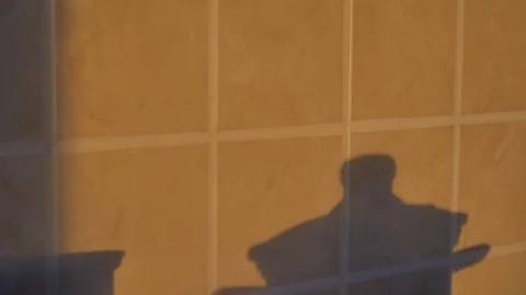 Shadow on the wall. The cook is preparing food. Stock-Footage 90083194