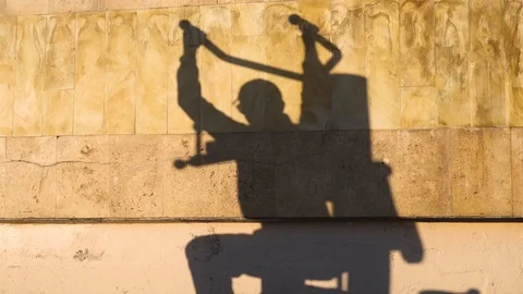 Shadow on the wall of the workout man at sunset Stock Footage 108929674