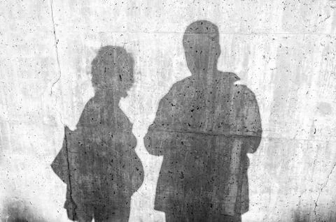 Shadow on a wall of a young couple Stock Photos