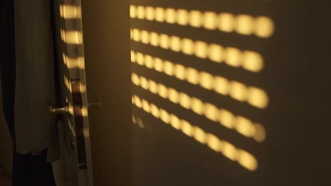 Shadow of window blinds on an apartment wall - dark room Video stock 102512020