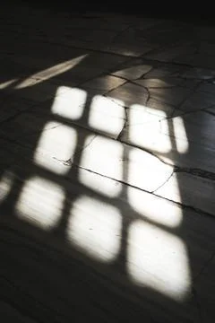 Shadow of the window on the concrete floor. Stock Photos