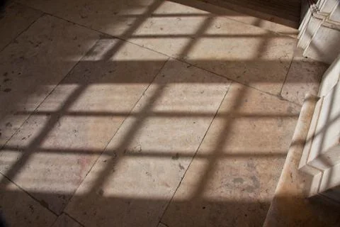 Shadow from a window on a marble floor Stock Photos