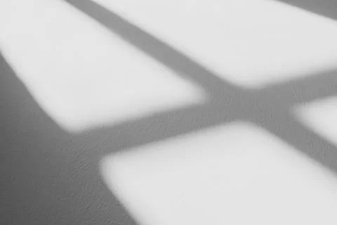 Shadow of window in morning light on white wall Stock Photos