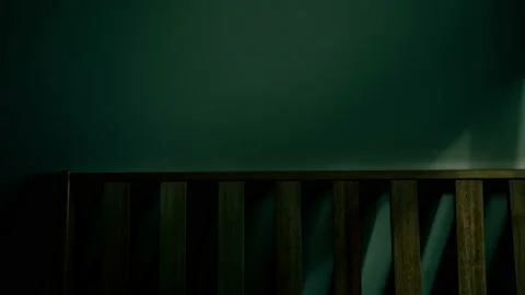 Shadow from window moving across a blank wall and furniture inside a plain room Stock Footage 162862040