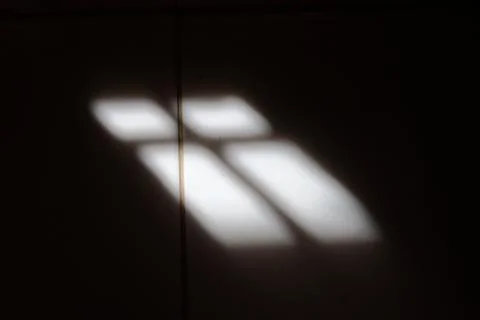 Shadow of window on tile floor Foto stock